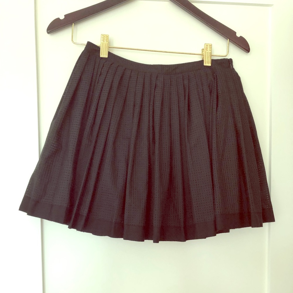 Pleated black mini skirt